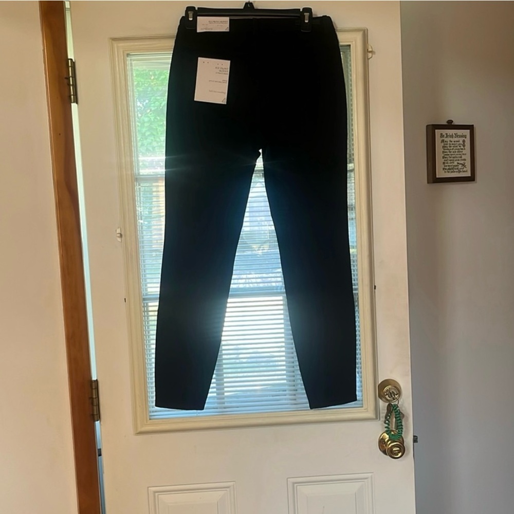 Two pair of ladies jeans size 4.  The black are NWT. White have been washed.